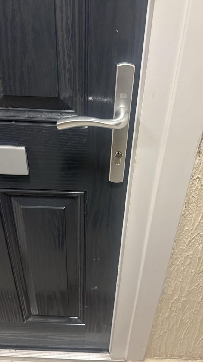 Grey composite front door with new silver handle and euro cylinder